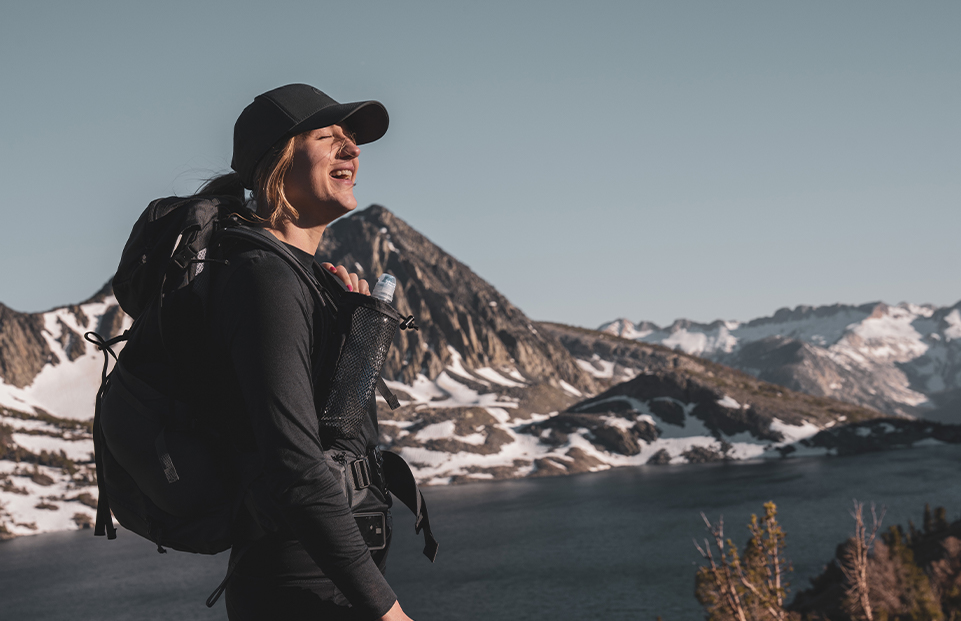 How should I carry water while hiking?